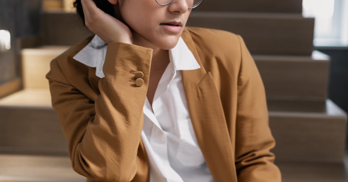 successful Indian woman looking thoughtful after work in a modern apartment