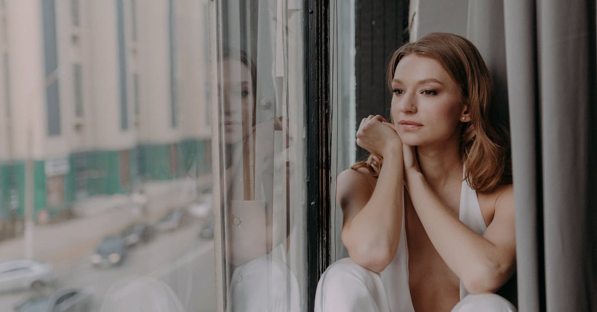 Successful woman looking thoughtfully alone in a luxurious apartment in Hyderabad