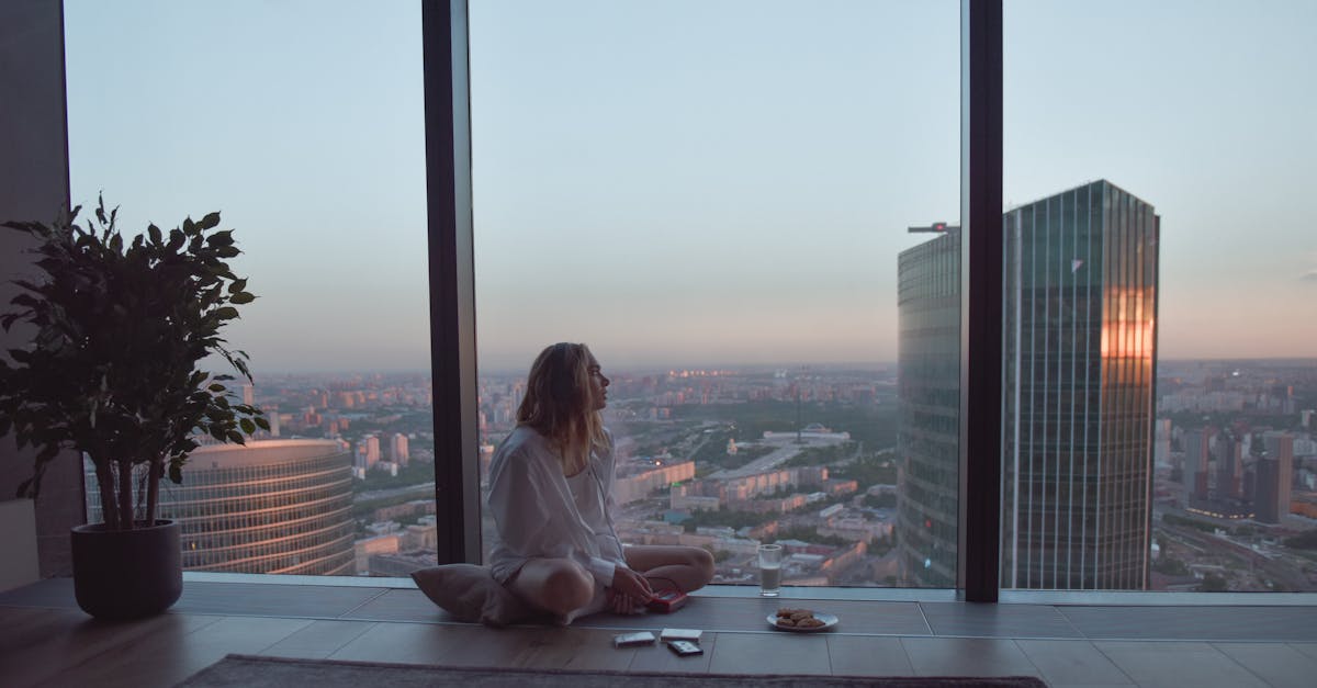 Hyderabad high-income woman contemplating work-life balance city view