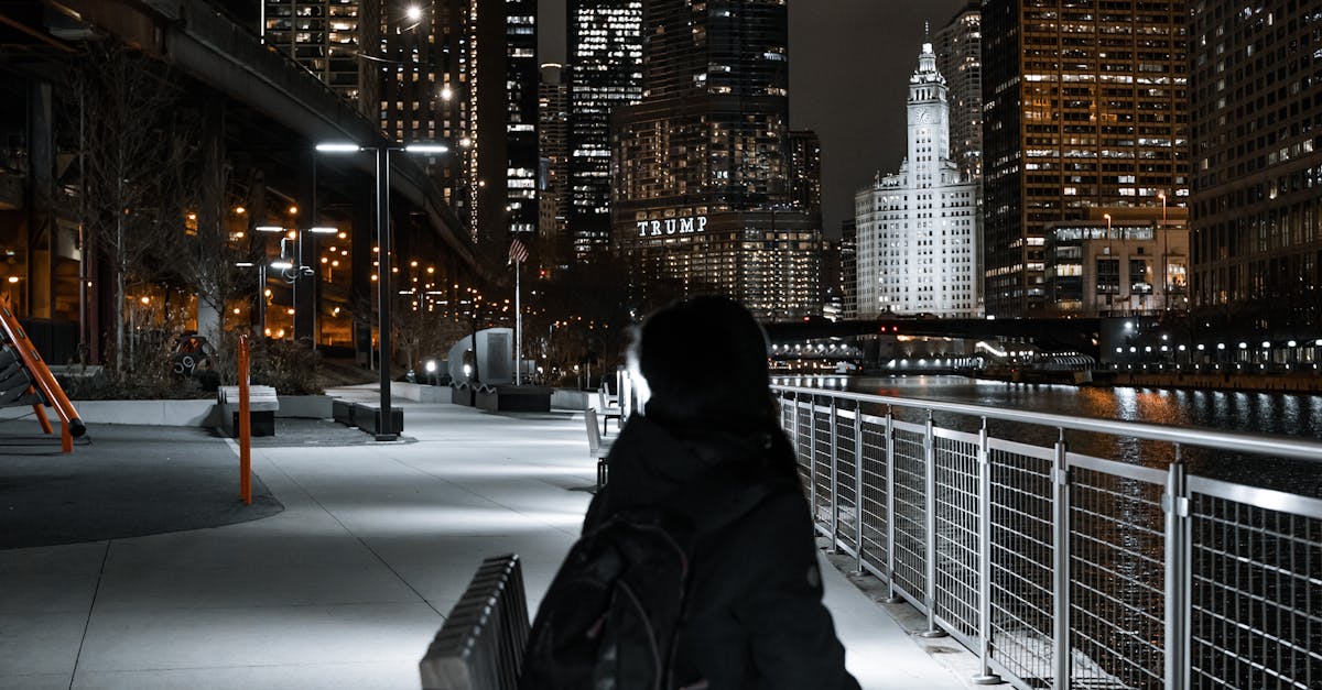 Corporate woman contemplating Hyderabad cityscape at night