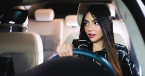 woman driving car at night Hyderabad