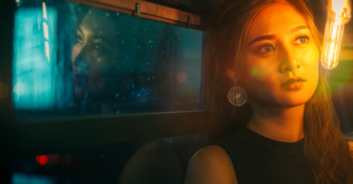 professional woman thoughtful night window hyderabad