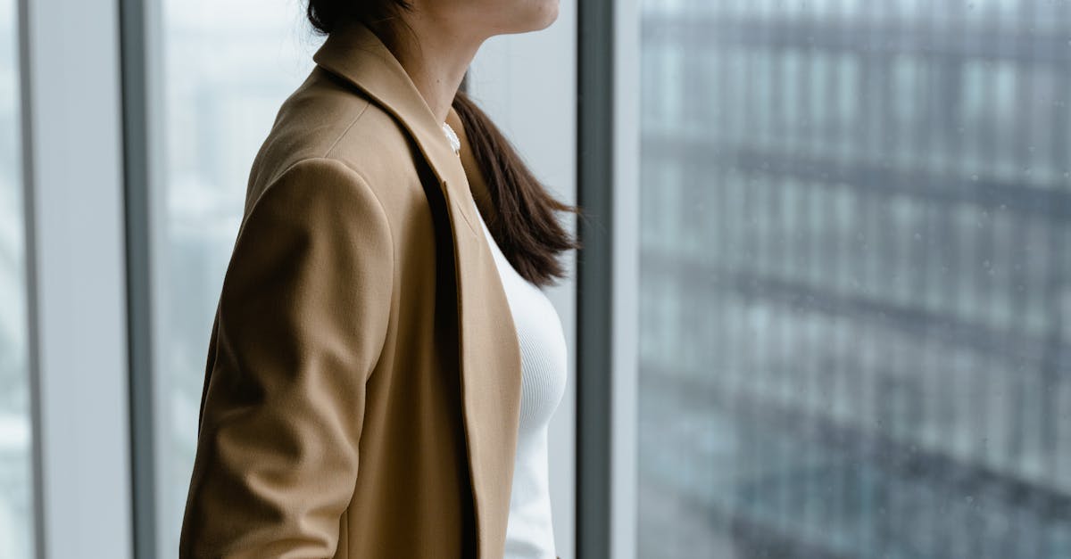 professional woman thinking at window Hyderabad
