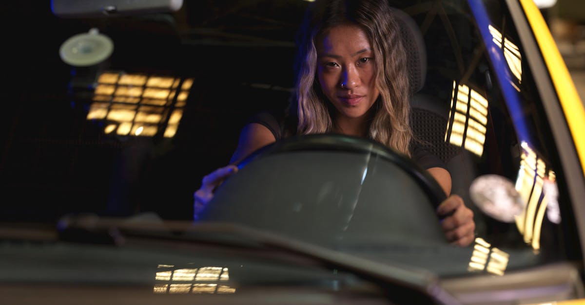professional woman driving at night