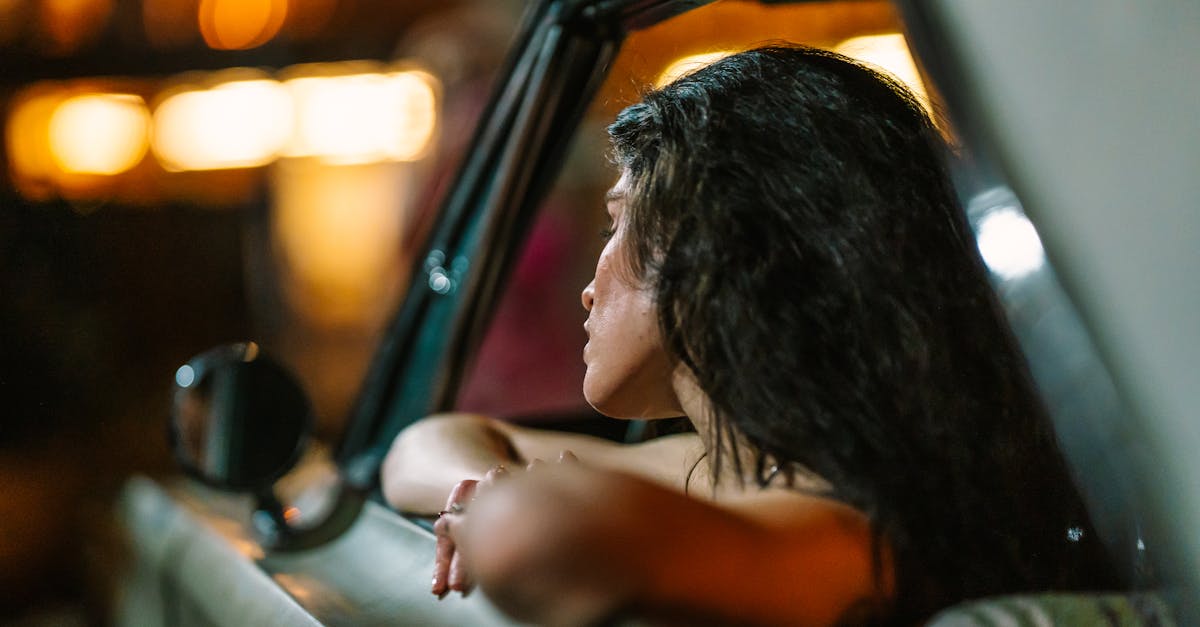 professional woman looking out window at night Hyderabad