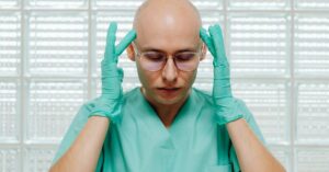 female doctor feeling exhausted