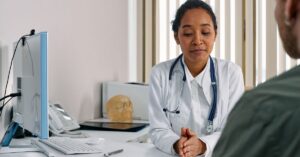 female doctor tired at desk