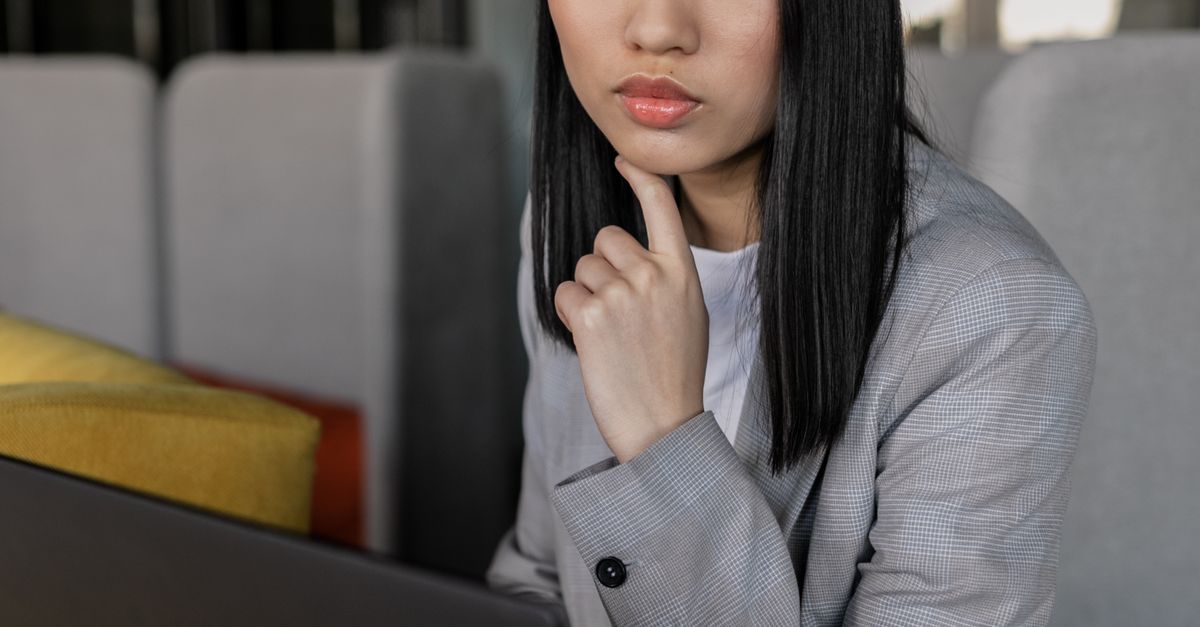 professional woman thinking laptop