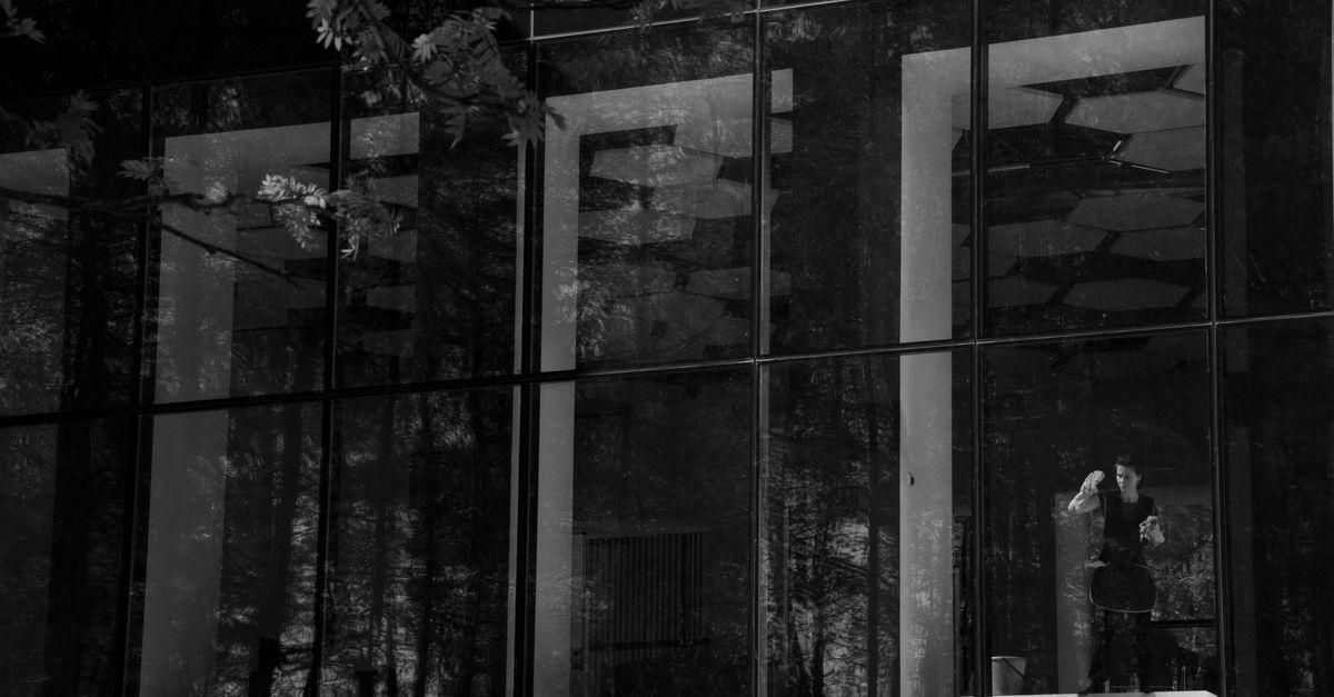 professional woman window reflection