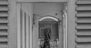 woman standing at window Hyderabad