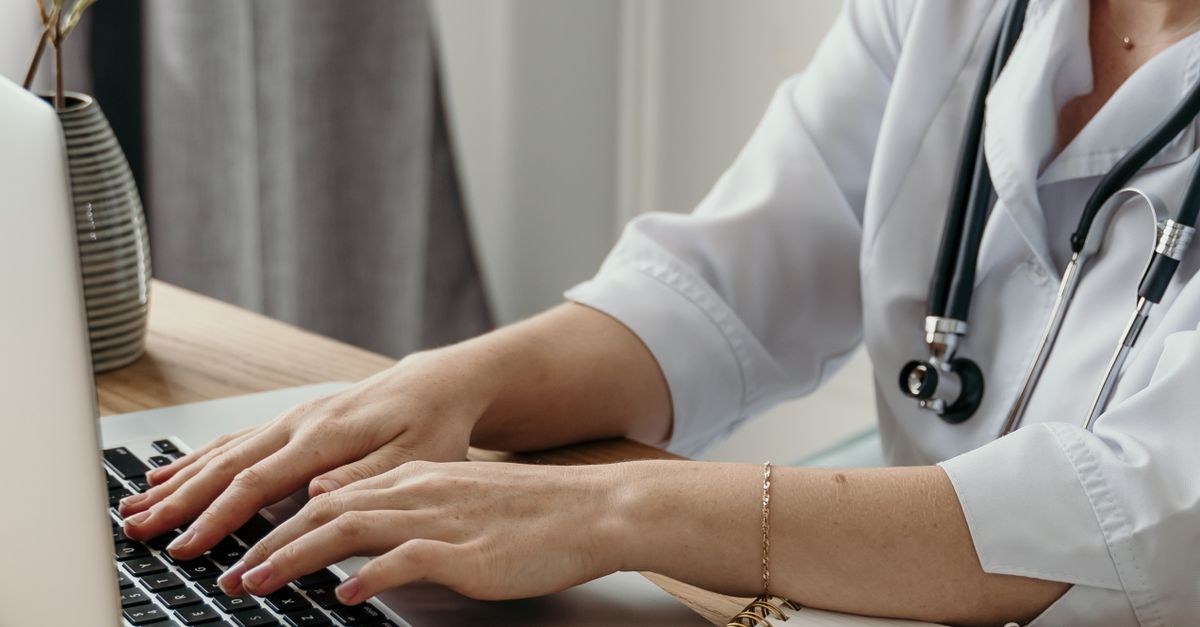female doctor working late laptop
