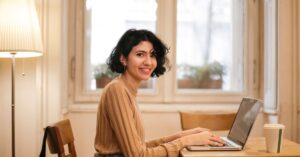 professional woman cafe laptop