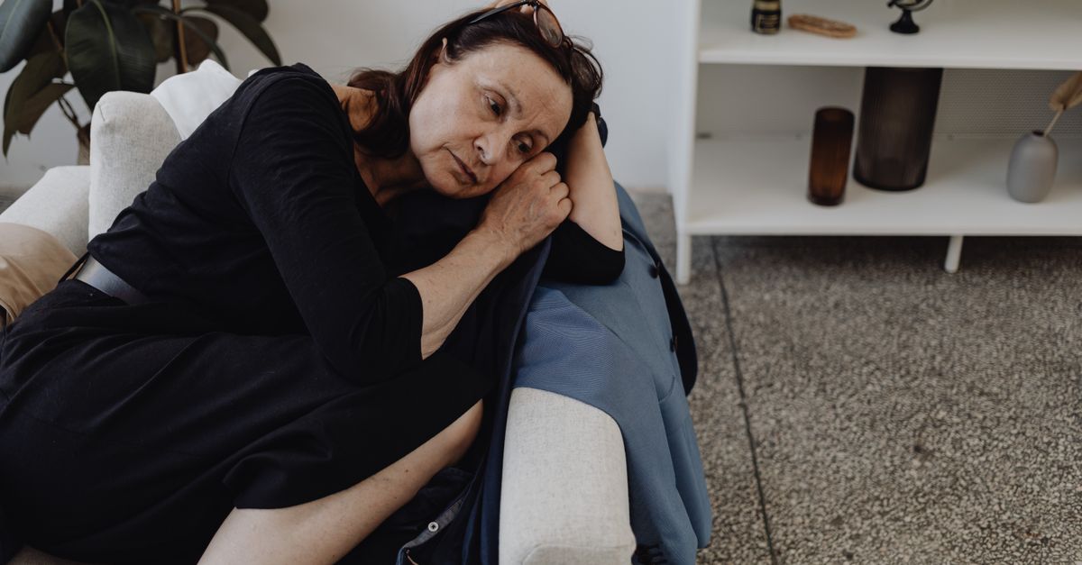 widowed woman alone living room